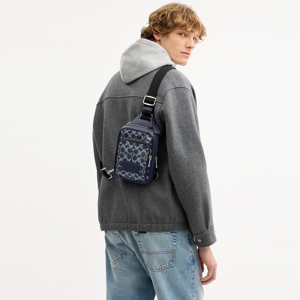 Coach Outlet Men's Racer Sling Pack In Signature Canvas With Charms